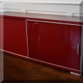 F20. Modern red and steel tone sliding door sideboard. 29"h x 69"w x 18"d  